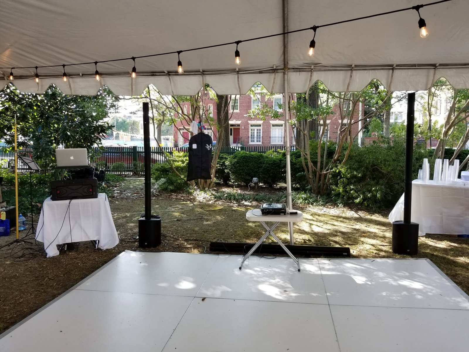 Elegant tented reception dance floor with string lighting