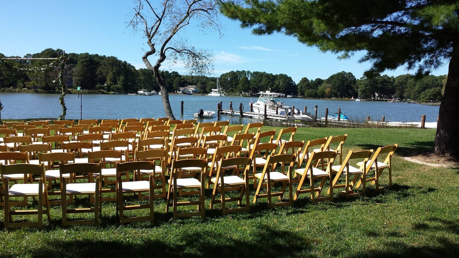 Samantha and Chris’s wedding, photo 2 — waterfront ceremony with the dock and boats