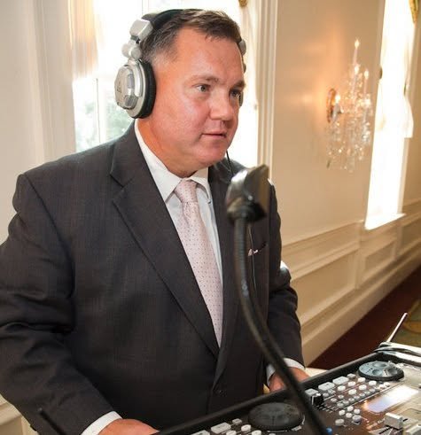 Ed Witles hosting and mixing from the DJ booth