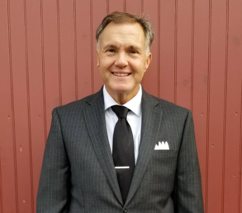 Ed Witles, founder and lead DJ of The Elegant DJ, in a charcoal suit